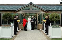 Essex Toastmaster Linda Palmer congratulating the bride and groom after their wedding ceremony with champagne toast